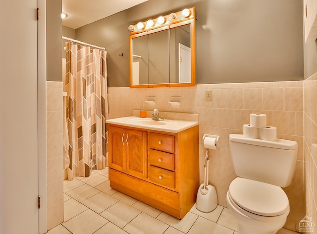 bathroom featuring tile walls, tile patterned flooring, vanity, toilet, and a shower with curtain