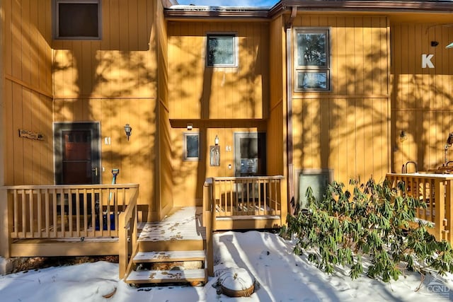 view of snow covered property entrance