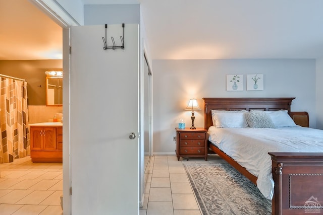 tiled bedroom with ensuite bath