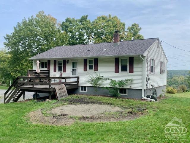 view of front of home featuring a deck and a front yard