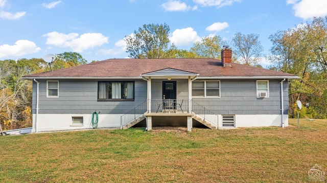 view of front facade featuring cooling unit and a front yard