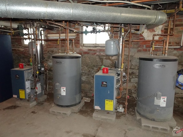 utilities with gas water heater, water heater, and a heating unit
