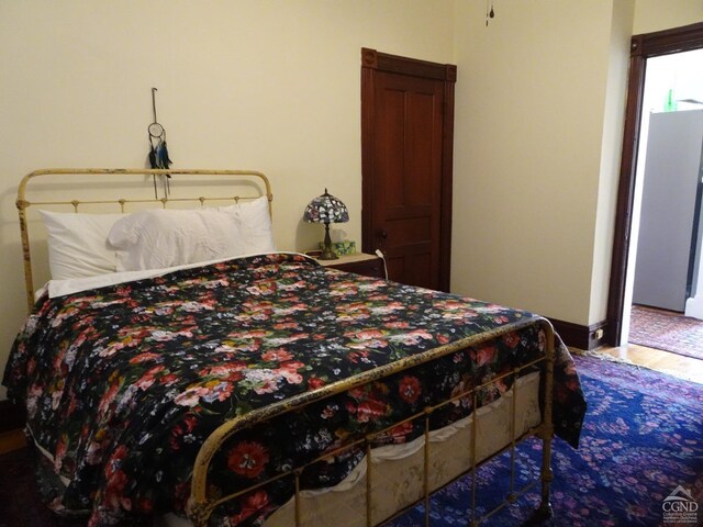bedroom featuring wood finished floors