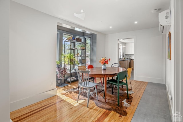 dining room featuring light hardwood / wood-style flooring and sink