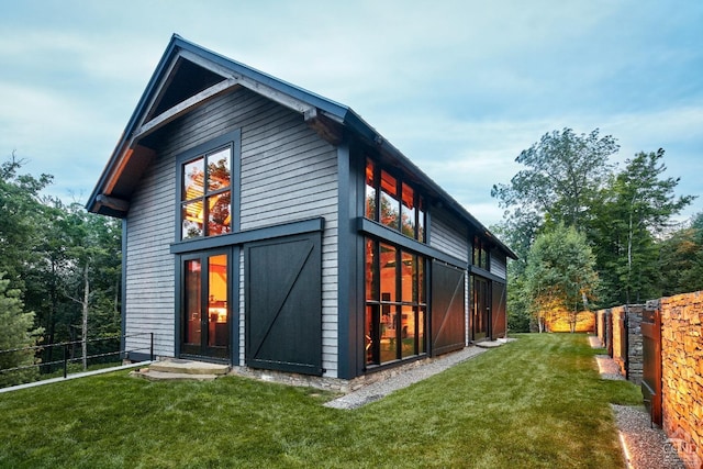 rear view of house with a lawn