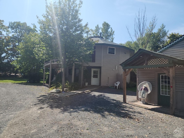 rear view of property with a gazebo