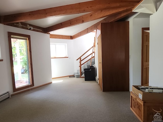 additional living space featuring beamed ceiling, carpet floors, and a baseboard radiator