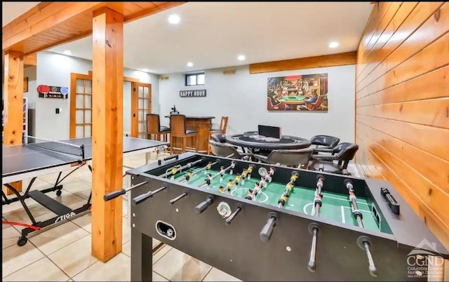 recreation room featuring tile patterned flooring and french doors