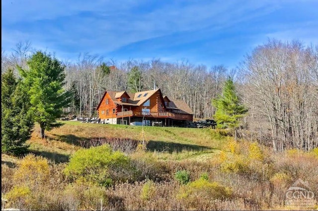 back of property featuring a deck