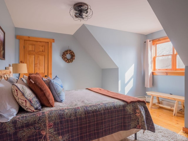 bedroom with hardwood / wood-style flooring