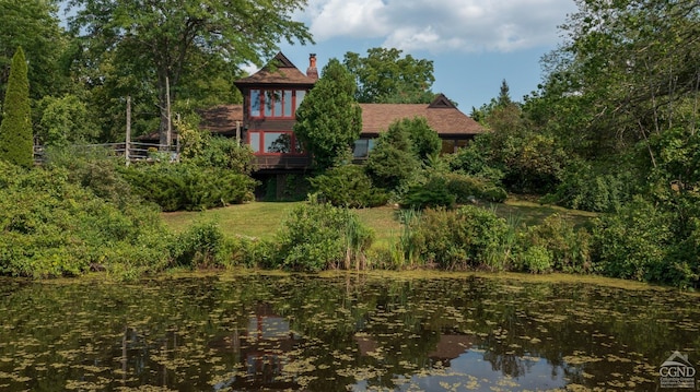 exterior space with a water view