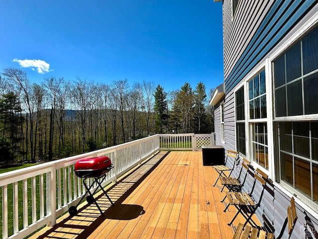 wooden terrace with area for grilling