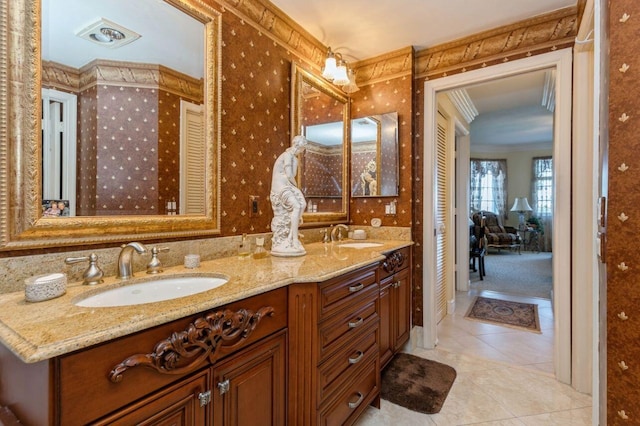 bathroom featuring vanity, tile patterned flooring, and ornamental molding