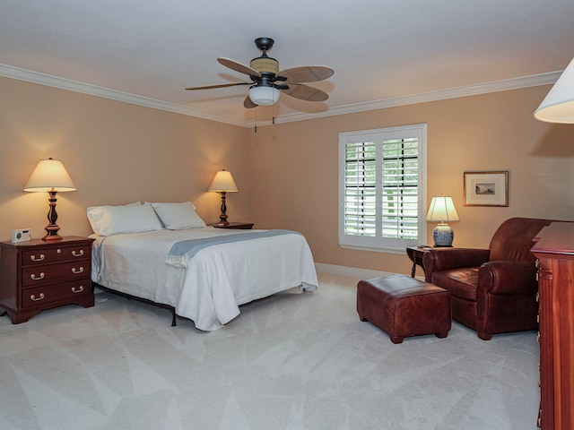 carpeted bedroom with ceiling fan and ornamental molding