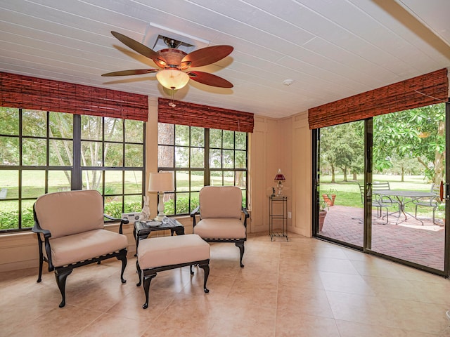 sunroom / solarium with ceiling fan