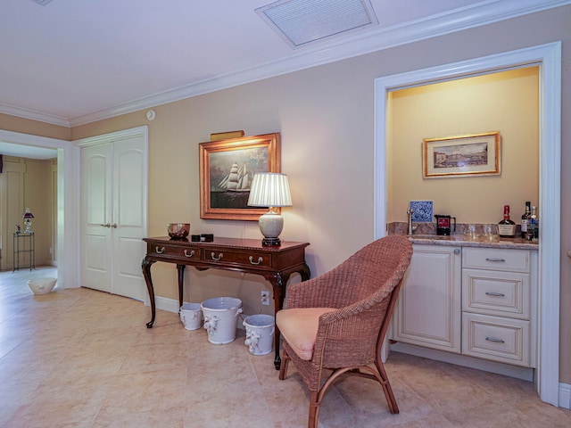 office space with bar and ornamental molding