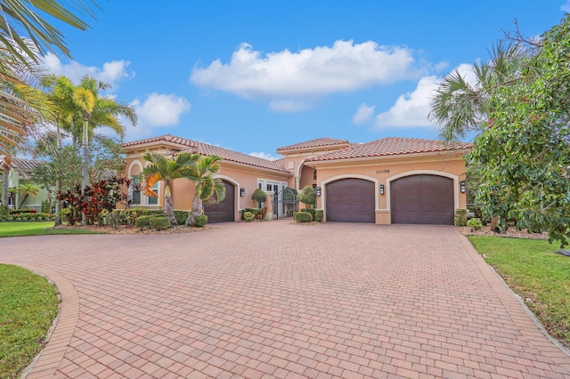 mediterranean / spanish-style home with a garage