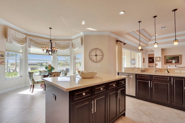 kitchen featuring a center island, hanging light fixtures, stainless steel dishwasher, ornamental molding, and dark brown cabinetry