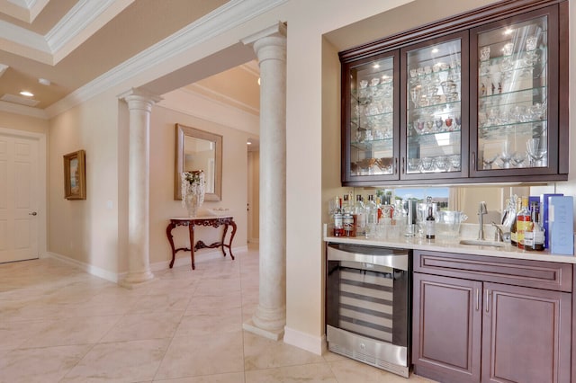 bar with light tile patterned floors, wine cooler, crown molding, and sink