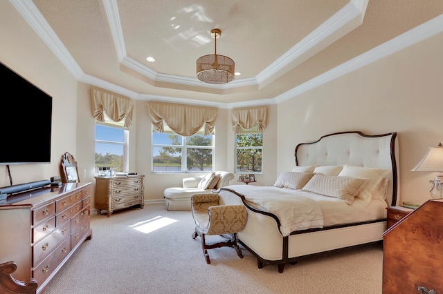 bedroom featuring a raised ceiling, light colored carpet, and ornamental molding