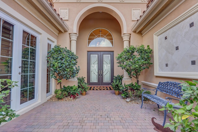 entrance to property featuring a patio and french doors