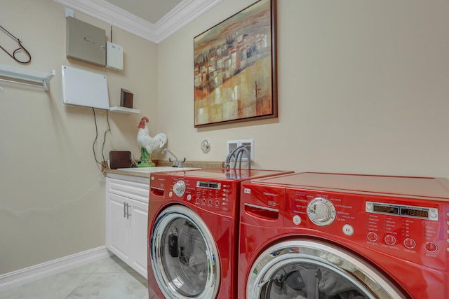 clothes washing area with washer and clothes dryer, cabinets, crown molding, sink, and light tile patterned floors