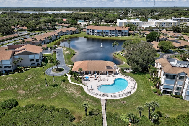 birds eye view of property with a water view