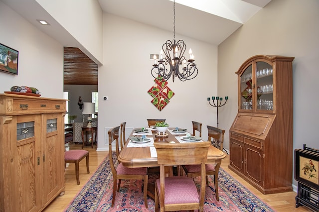 3961 NW 27th Ave, Boca Raton, FL 33434 - dining space featuring light wood finished floors, a chandelier, and high vaulted ceiling