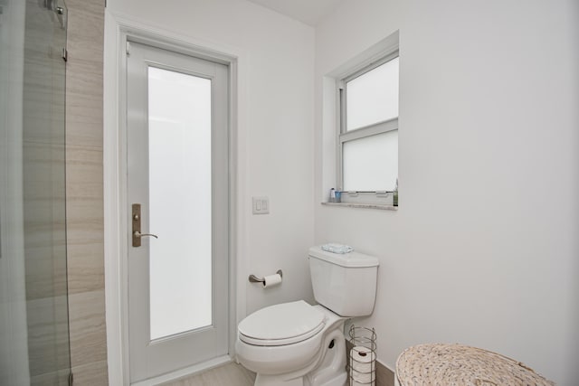 3961 NW 27th Ave, Boca Raton, FL 33434 - bathroom featuring toilet and an enclosed shower
