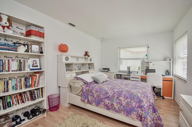 3961 NW 27th Ave, Boca Raton, FL 33434 - bedroom with multiple windows and light wood-style floors
