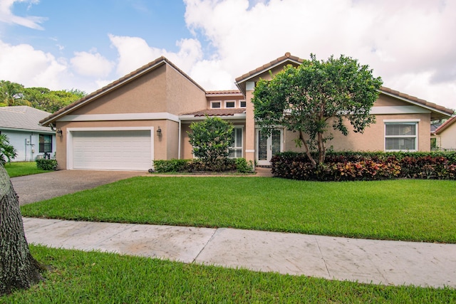 3961 NW 27th Ave, Boca Raton, FL 33434 - view of front of property with asphalt driveway, a tiled roof, an attached garage, and stucco siding