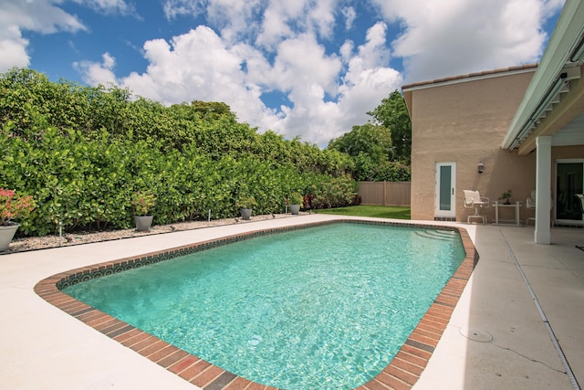 3961 NW 27th Ave, Boca Raton, FL 33434 - view of swimming pool featuring a patio
