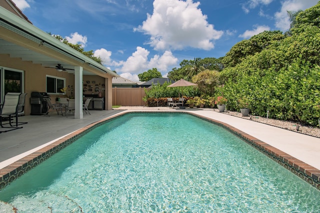 3961 NW 27th Ave, Boca Raton, FL 33434 - view of pool with a patio area, a ceiling fan, grilling area, and outdoor dining area