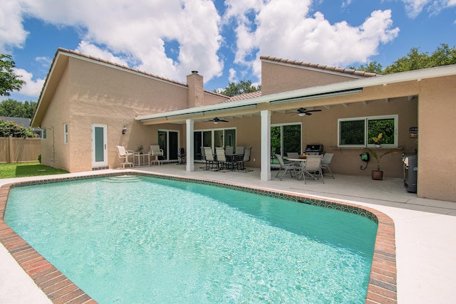 3961 NW 27th Ave, Boca Raton, FL 33434 - swimming pool featuring a ceiling fan, outdoor dining space, and a patio