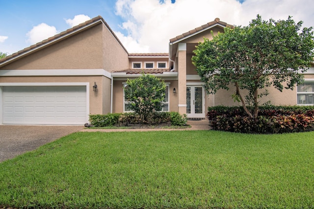 3961 NW 27th Ave, Boca Raton, FL 33434 - view of front facade with stucco siding, asphalt driveway, a front lawn, and a tiled roof