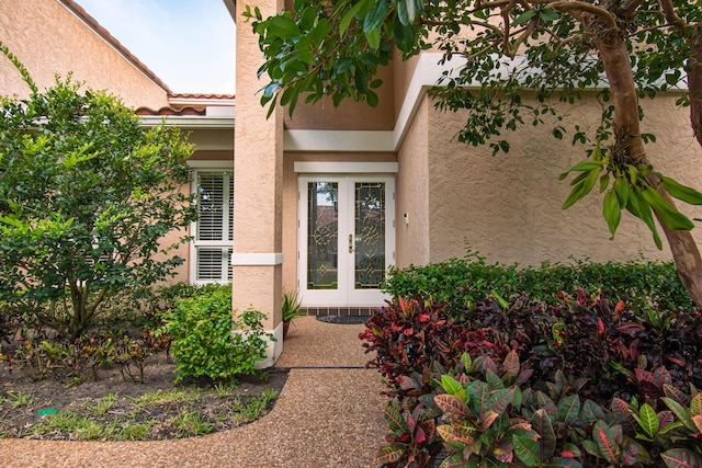 3961 NW 27th Ave, Boca Raton, FL 33434 - doorway to property featuring french doors and stucco siding