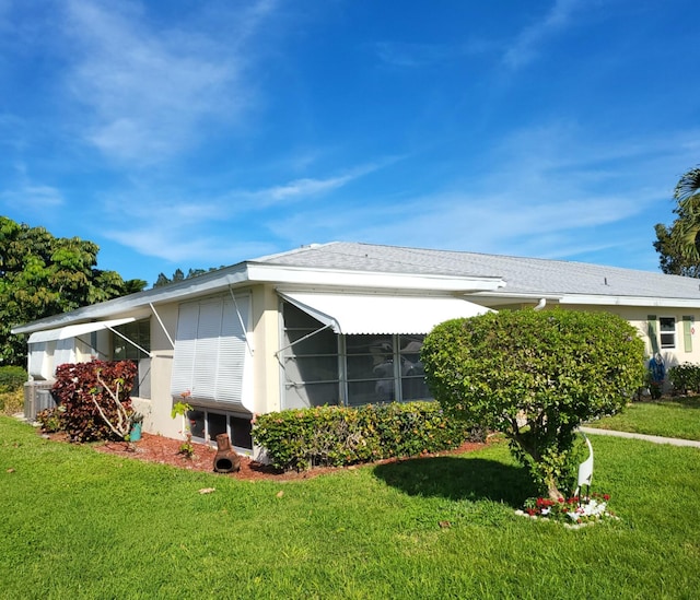 view of home's exterior with a yard