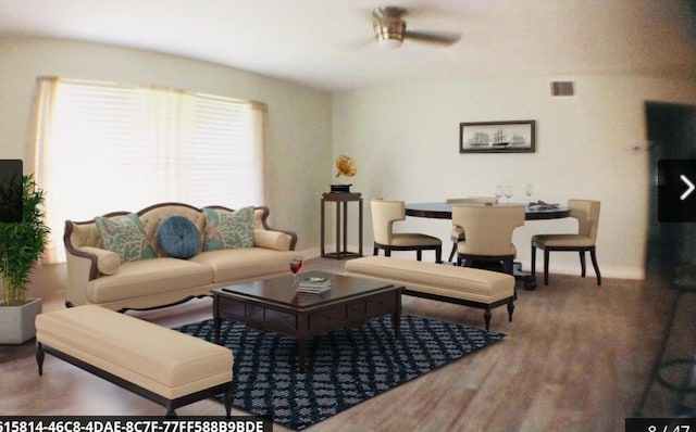 living room featuring ceiling fan and hardwood / wood-style floors