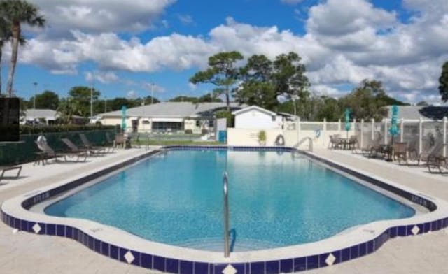 view of swimming pool featuring a patio area