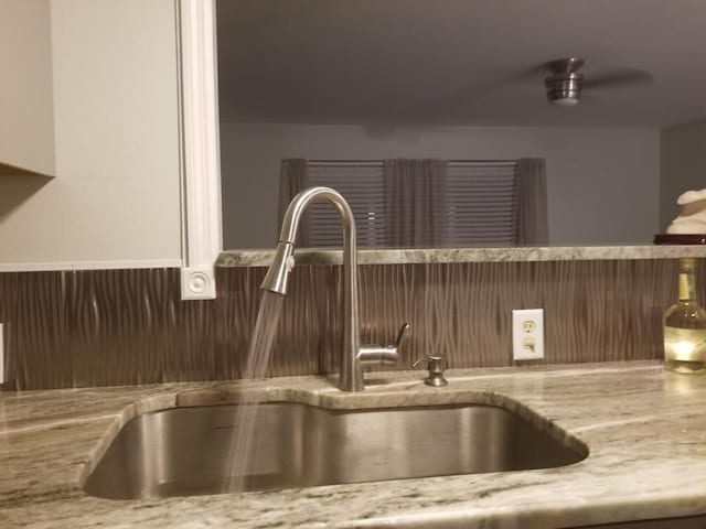 interior details with sink and light stone counters