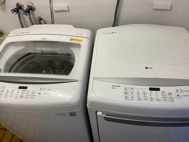 laundry room featuring separate washer and dryer