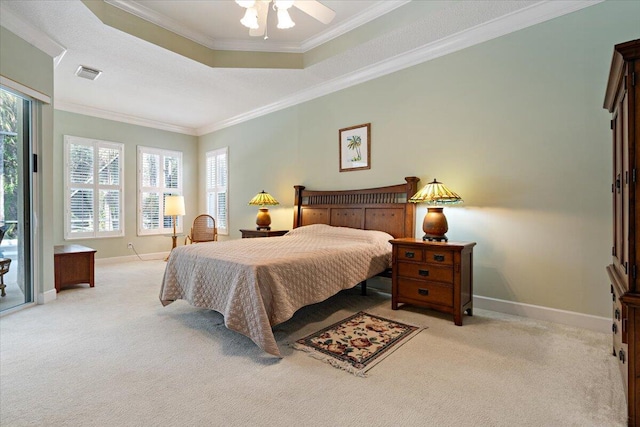 bedroom featuring light carpet, multiple windows, ornamental molding, and a raised ceiling