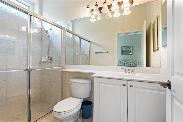 bathroom with vanity, toilet, and walk in shower