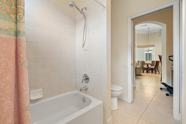 bathroom featuring shower / tub combo with curtain, a chandelier, tile patterned flooring, ornamental molding, and toilet