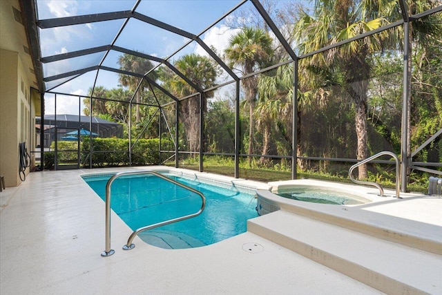 view of swimming pool with a patio area, an in ground hot tub, and glass enclosure