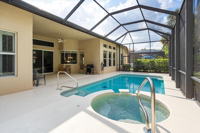 view of swimming pool featuring a lanai, a patio area, and ceiling fan