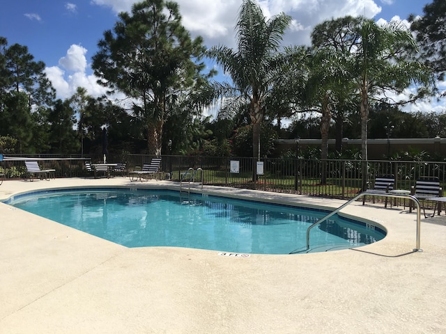 view of swimming pool featuring a patio area