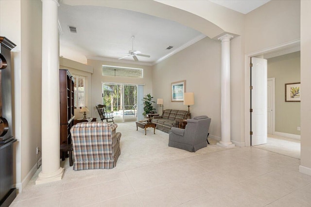 tiled living room with ceiling fan, ornamental molding, and decorative columns