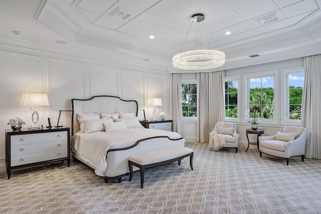 bedroom with a decorative wall, light colored carpet, ornamental molding, and visible vents