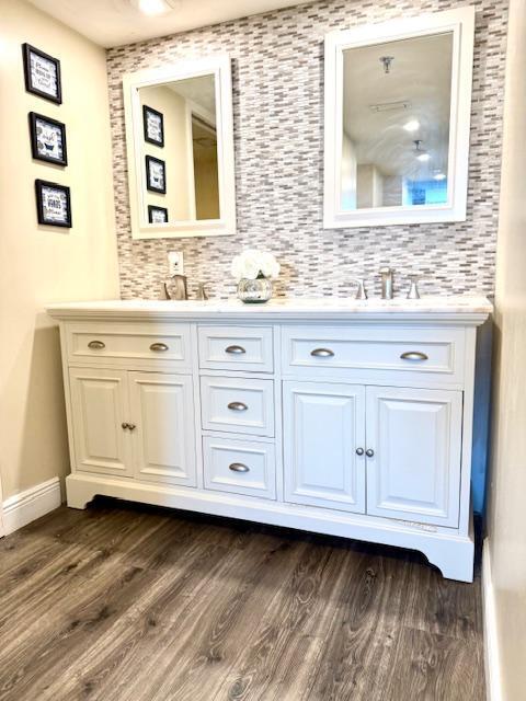 bathroom featuring hardwood / wood-style flooring and vanity